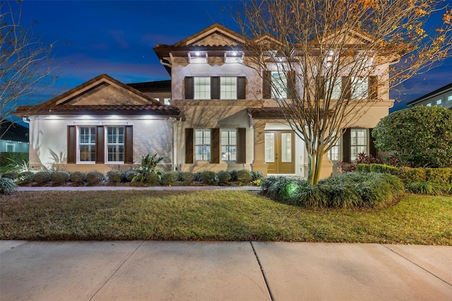 view of front of house with a yard