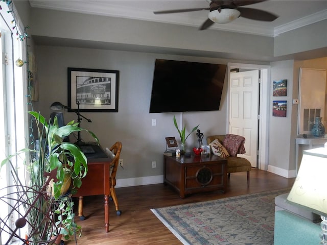 living room featuring crown molding, dark wood-type flooring, and ceiling fan