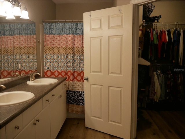 bathroom featuring hardwood / wood-style flooring and vanity