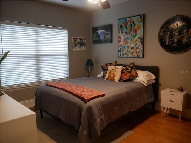 bedroom featuring ceiling fan and light wood-type flooring