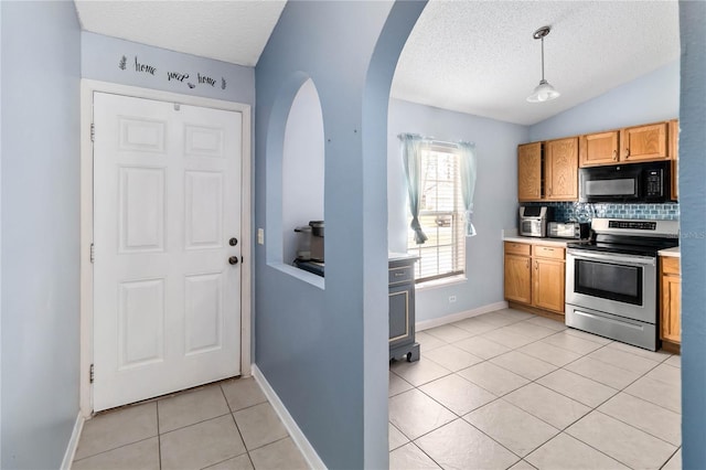 kitchen featuring lofted ceiling, tasteful backsplash, decorative light fixtures, light tile patterned floors, and stainless steel electric stove