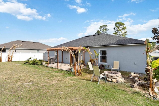 back of house with a patio, a pergola, a yard, and an outdoor fire pit