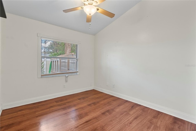 unfurnished room with hardwood / wood-style flooring, ceiling fan, and vaulted ceiling