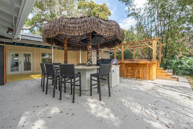 view of patio featuring a bar and french doors