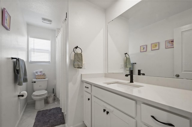 bathroom with vanity and toilet