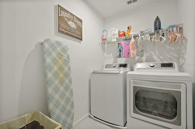 laundry area featuring independent washer and dryer