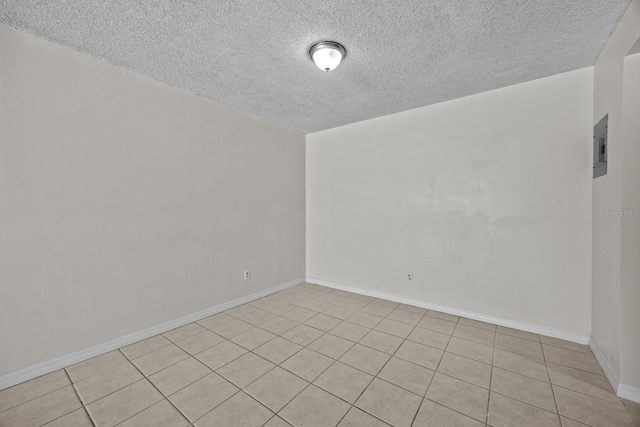 spare room featuring a textured ceiling