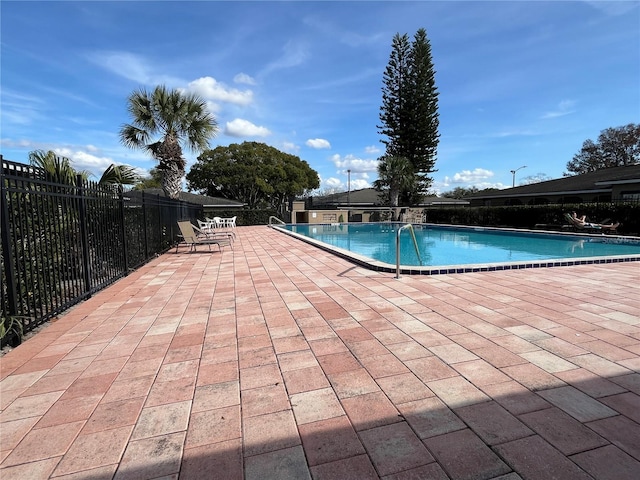 view of swimming pool with a patio area