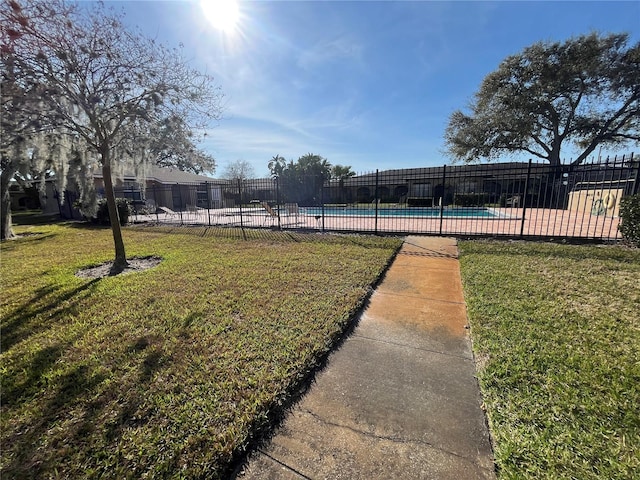 view of yard with a community pool