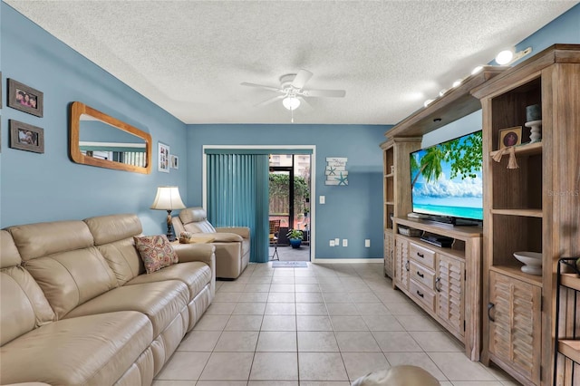 tiled living room with a textured ceiling and ceiling fan