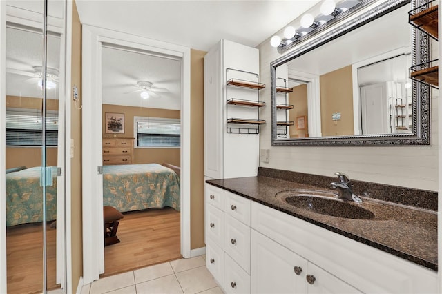 bathroom featuring vanity, tile patterned floors, and ceiling fan