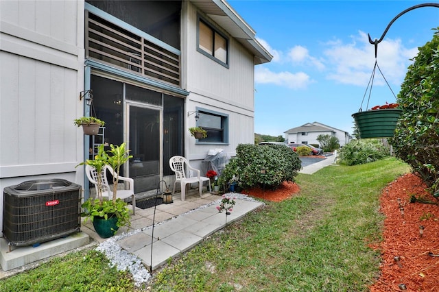 view of yard featuring central AC and a patio area