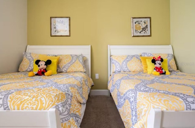 bedroom with dark carpet