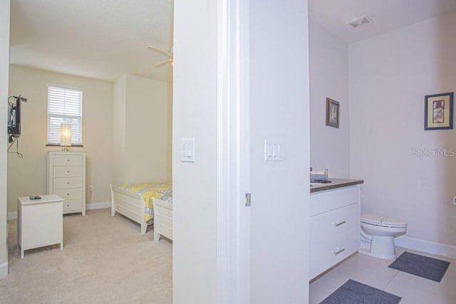 bathroom with ceiling fan, vanity, and toilet