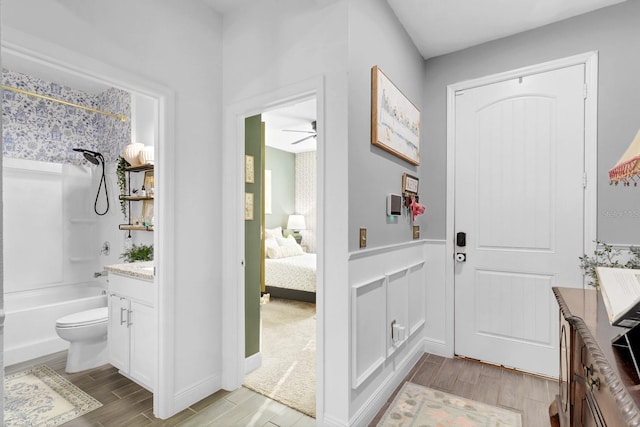 full bathroom featuring vanity, toilet, and bathing tub / shower combination