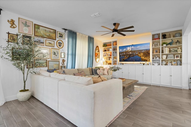 living room featuring ceiling fan