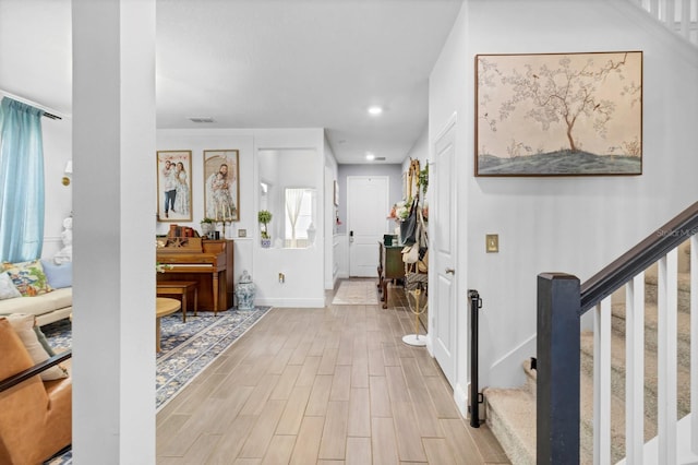 foyer entrance featuring light hardwood / wood-style flooring