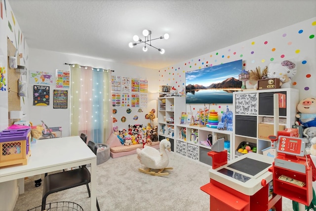 rec room featuring carpet flooring, a chandelier, and a textured ceiling