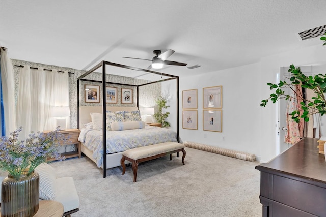 bedroom with light carpet and ceiling fan