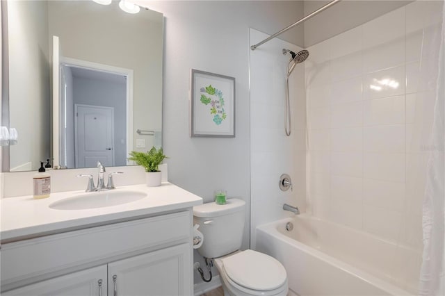 bathroom with toilet, vanity, and shower / bath combo