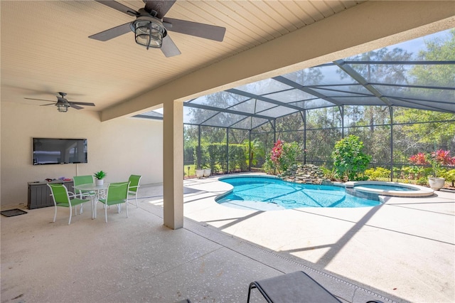 view of swimming pool with glass enclosure, a pool with connected hot tub, outdoor dining area, and a patio