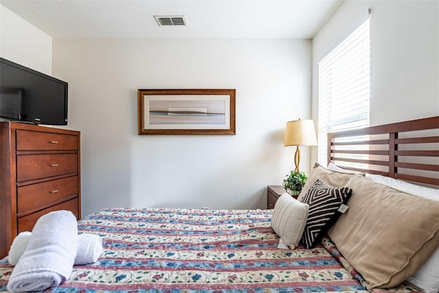 bedroom featuring a textured ceiling