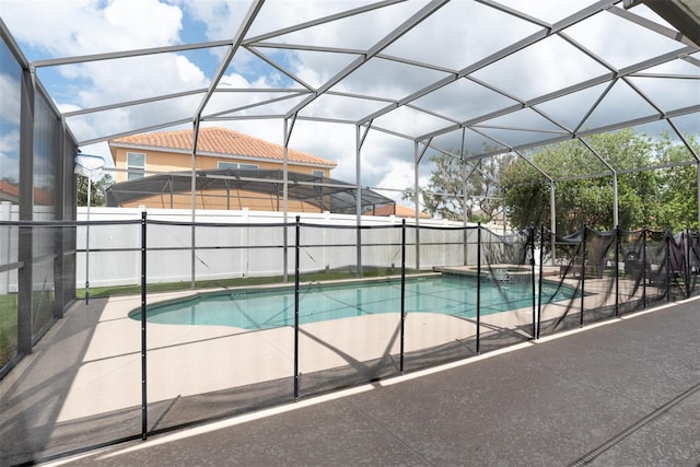 view of pool featuring an in ground hot tub, a lanai, and a patio area