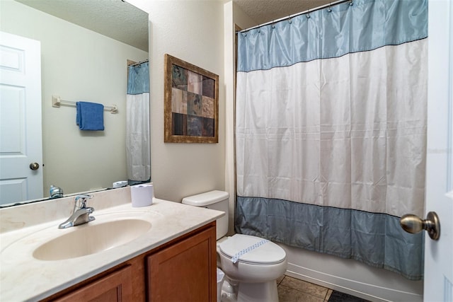full bathroom with vanity, toilet, shower / tub combo, and a textured ceiling
