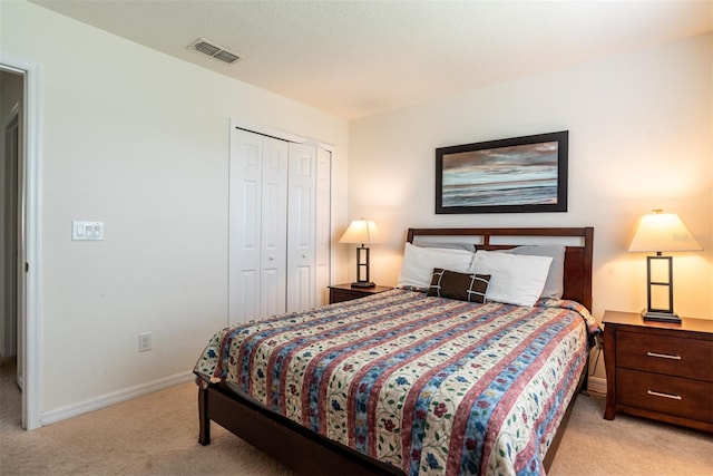 carpeted bedroom featuring a closet