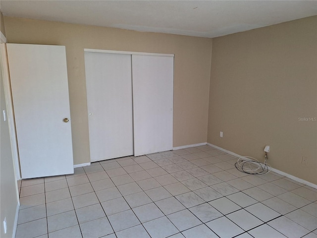 unfurnished bedroom with a closet