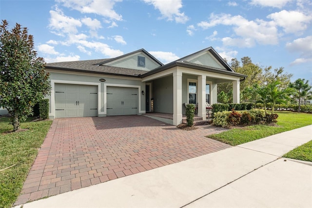 view of front facade featuring a garage and a front lawn