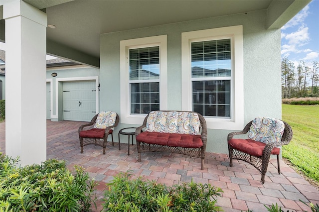 view of patio featuring a garage