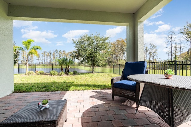 view of patio / terrace with a water view