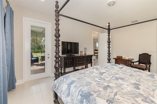 bedroom with access to exterior and light tile patterned floors