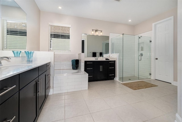 bathroom featuring vanity, tile patterned floors, and separate shower and tub