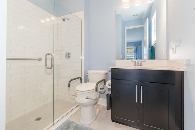 bathroom featuring vanity, tile patterned floors, toilet, and walk in shower