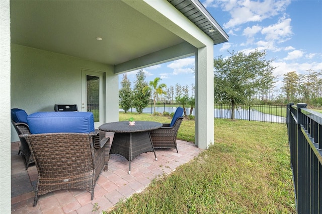 view of patio featuring a water view