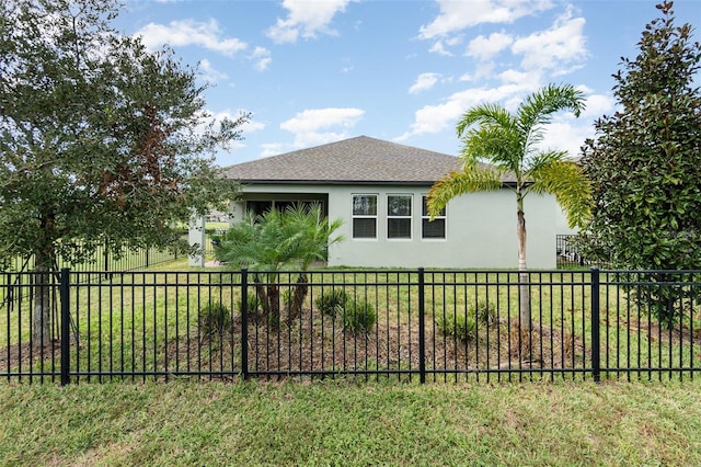 view of side of home with a lawn