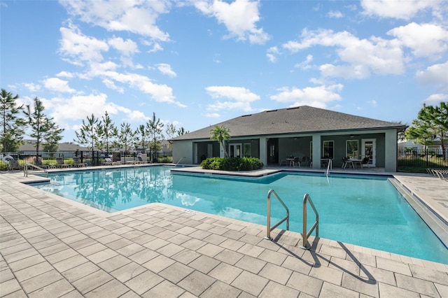 view of swimming pool with a patio area