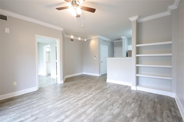 unfurnished living room with crown molding, ceiling fan, wood-type flooring, and built in features