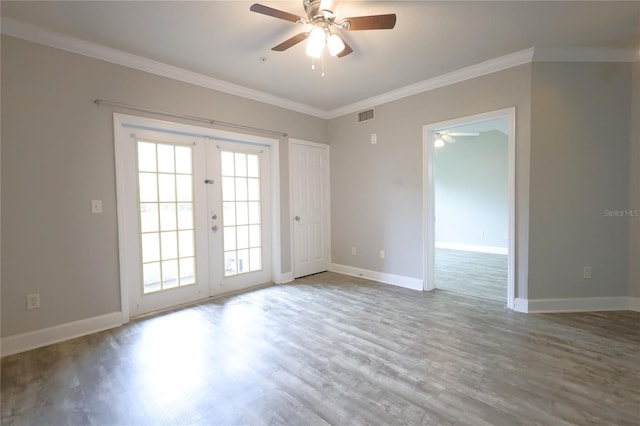 spare room with ornamental molding, ceiling fan, light hardwood / wood-style floors, and french doors