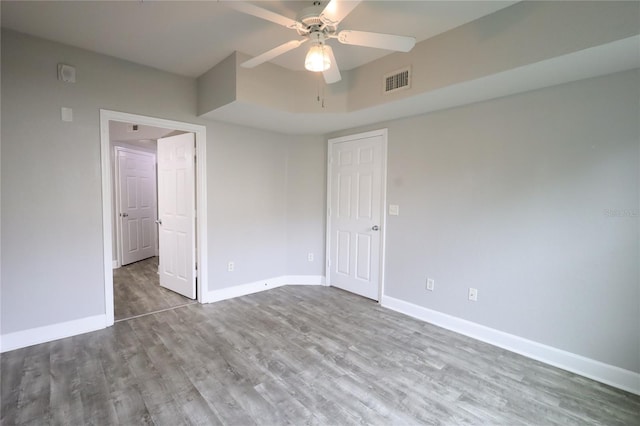 unfurnished bedroom with hardwood / wood-style flooring and ceiling fan