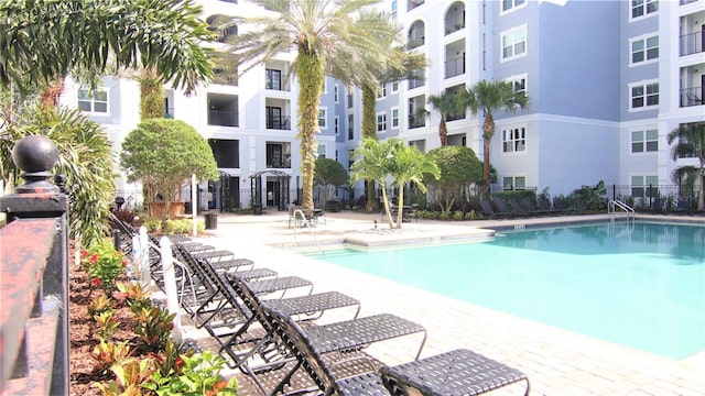 view of swimming pool featuring a patio area