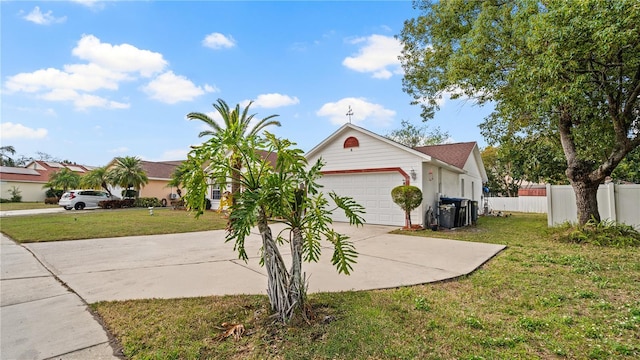 single story home featuring a garage and a front yard