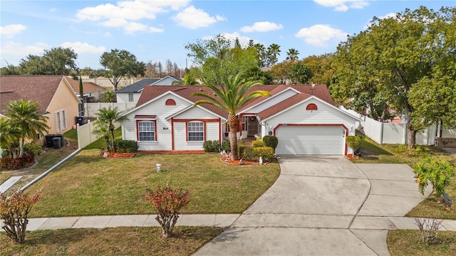 view of front of house with a garage and a front yard