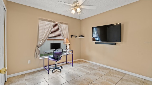 tiled office with a textured ceiling and ceiling fan