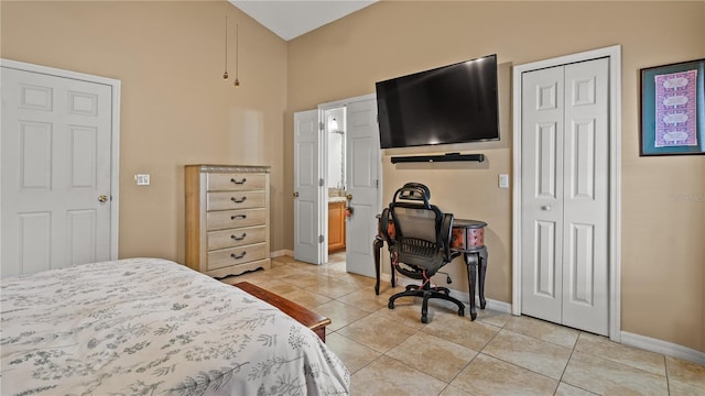 tiled bedroom with a closet