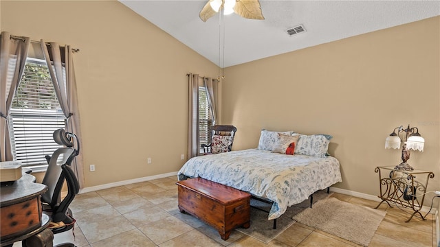 bedroom featuring ceiling fan, vaulted ceiling, and light tile patterned floors