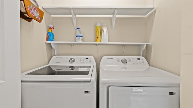 laundry area with washing machine and dryer