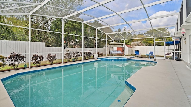 view of pool featuring an in ground hot tub, a lanai, and a patio area